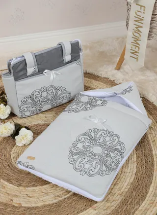 Newborn baby meds with portable diaper storage bag gray color decorated with geometric drawings 