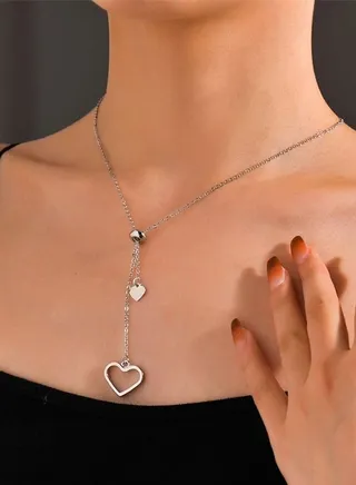 Unique and distinctive women necklace with two hanging hearts design in silver color one of the elegant women accessories 