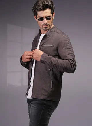 Stylish, slim-fit jacket with textured design, stand collar, and modern zip details. 