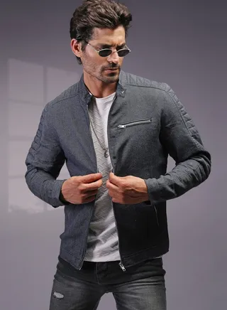 Stylish, slim-fit jacket with textured design, stand collar, and modern zip details. 