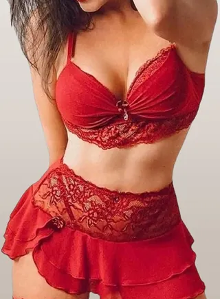 An elegant lingerie set for women, two pieces, a short skirt and a top decorated with lace 