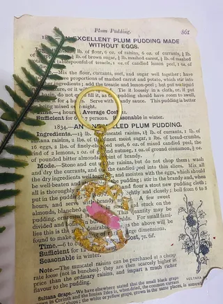 Keychain decorated with dried roses and gold leaf letter S made of luxurious resin 