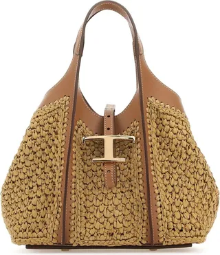 Handbag realized in raffia with leather inserts enriched by metal T detail at the front.
