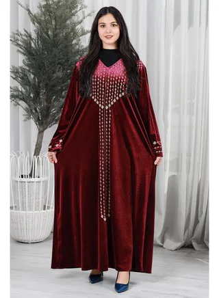 Red velor jalabiya decorated with golden embroidery on the front 