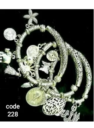 A set of women's and girls' bracelets of nickel silver with multiple pendants 