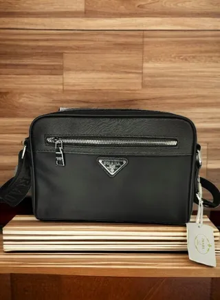 "Chic Allure: Unveiling the Prada Clutch Bag - Elevate Your Glam Quotient 
