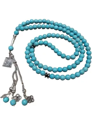 Turquoise rosary of 99 beads, with a religious silver pendant and distinctive beads 