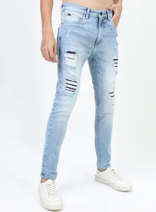 Mid Rise Light Fade Distressed Jeans