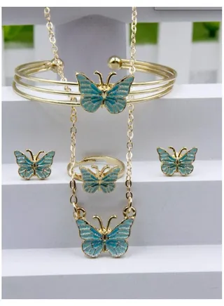 Elegant and distinctive women accessories set consisting of chain with butterfly-designed pendant earrings bracelet and ring 