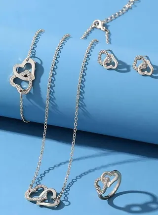 Fashionable women accessories set consisting of necklace with two hearts design with ring earrings and bracelet 