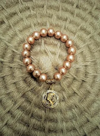 Handmade gemstone bracelet with golden Nefertiti pendant 