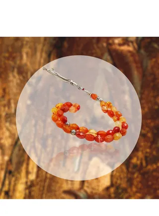 This 8mm oval brown onyx bead strand features a natural brown color that enhances the beauty of the stone 