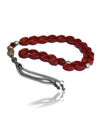 Luxurious onyx rosary in a matte brown color with a simple and elegant design, highlighting the beauty of the onyx grains and adding a touch of magic to it. 