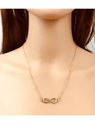 Elegant women's necklace infinity design studded with shiny crystals 