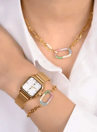 A watch set with a bracelet and a chain with a crystal-encrusted ring 