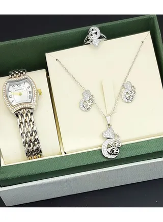 A set of an analog watch and a set consisting of a necklace, earring and a ring for women 