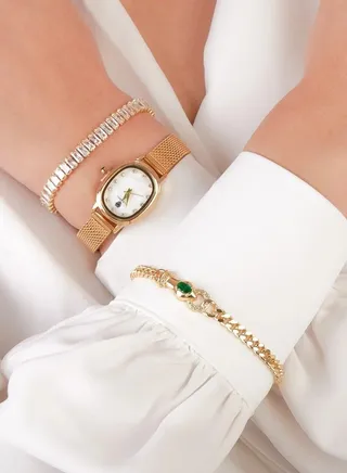 A golden watch set with two bracelets adorned with luxurious zirconia 