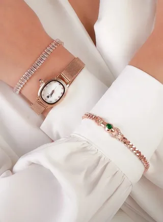A rose gold watch set with two bracelets adorned with luxurious zirconia 