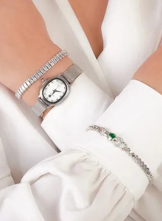 A silver watch set with two bracelets adorned with luxurious zirconia 