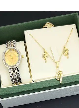 A set of an analog watch and a set consisting of a necklace, earring and a ring for women 