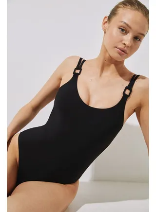Shaping swimsuit with black washers 