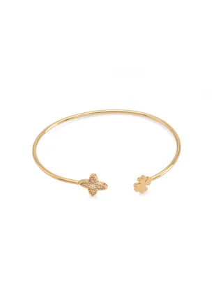 A bracelet with a clover leaf and flower design on both ends 