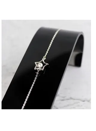 Unique silver women's bracelet with star pendant design 