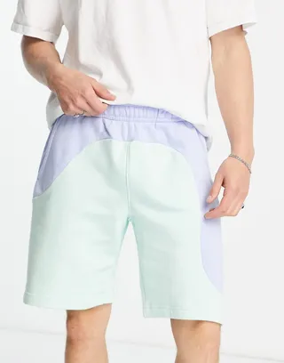 Nike Color Clash color block shorts in pale blue