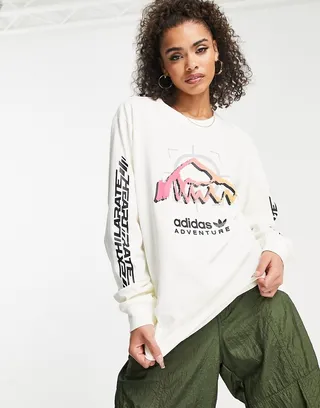 adidas Originals Adventure boyfriend fit long sleeve top in off-white with front graphics