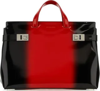 Handbag realized in smooth leather characterized by embossed logo at the front enriched by leather straps with metal Gancini details on the sides.