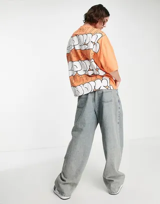 ASOS Unrvlld Spply oversized T-shirt with logo bubble graffiti print in orange