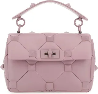 Handbag realized in quilted lamb nappa leather enriched by metal studs on the entire surface.