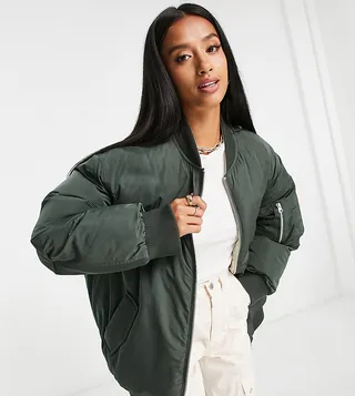 ASOS DESIGN Petite reversible quilted bomber jacket in khaki and cream