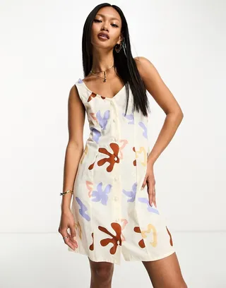 ASOS DESIGN linen sweetheart mini dress with button detail in abstract print