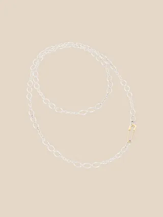 Dodo necklace in silver chain with 18 kt yellow gold pin