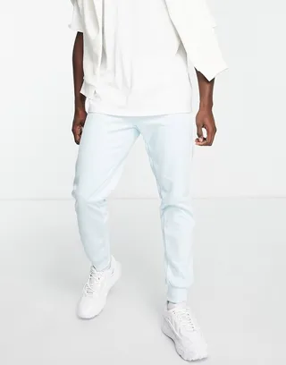 adidas Originals adicolor Challenger three stripe slim fit sweatpants in almost blue