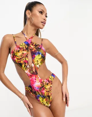 ASOS DESIGN cross neck cut out swimsuit in vibrant abstract graphic print