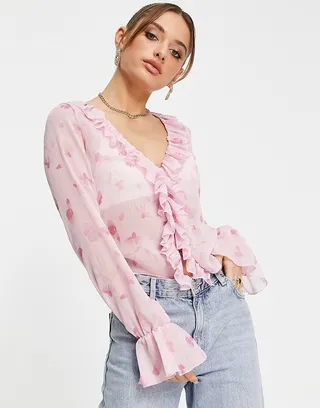 ASOS DESIGN frill neck volume sleeve top with button front in pink floral