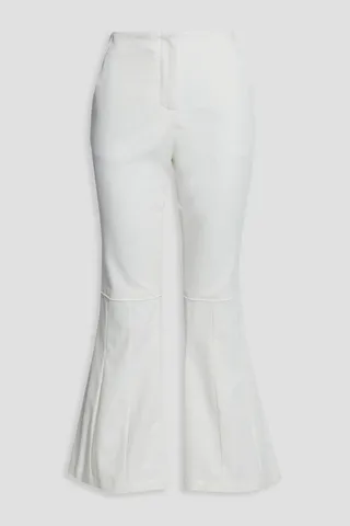 Frayed pleated cotton-blend twill kick-flare pants