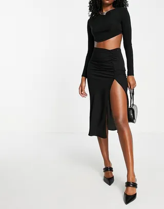 ASOS DESIGN midi skirt with ruched side and button detail in black