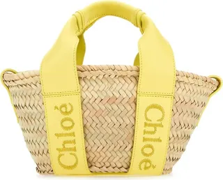 Daffodil yellow Raffia Small Sense Handbag from Chloé Handbag realized in raffia with leather inserts enriched by leather logoed bands on the sides.