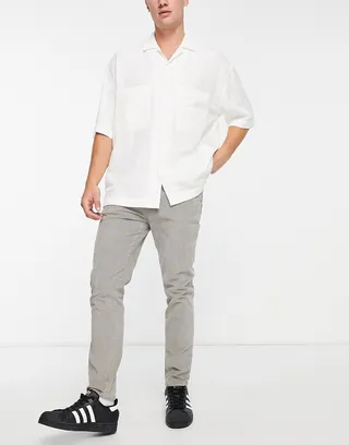 ASOS DESIGN skinny cord pants in charcoal with snow wash