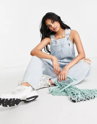 Dr Denim overalls with ripped knees in light blue wash