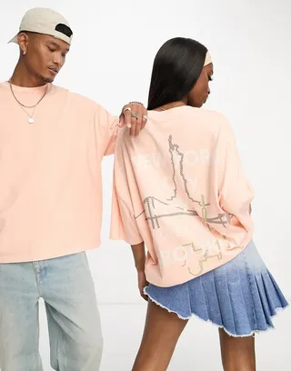 ASOS DESIGN unisex oversized t-shirt with large back graphic print in coral wash