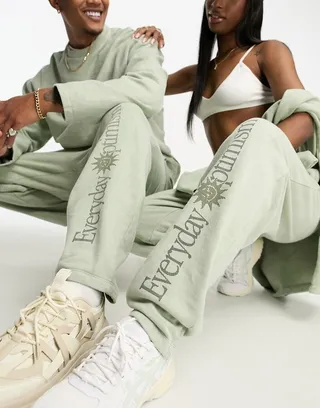 ASOS DESIGN unisex relaxed sweatpants with leg print in olive wash - part of a set