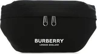 Belt bag realized in nylon with tonal leather inserts enriched by contrasting logoed patch at the front.