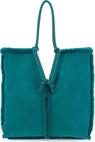 Reversible Shoulder Bag Realized In Shearling Characterized By Peculiar Tonal Leather Round Handles.