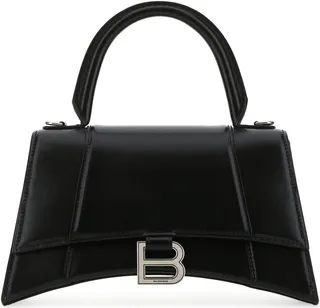 Handbag realized in smooth calf leather enriched by metal B detail at the front.