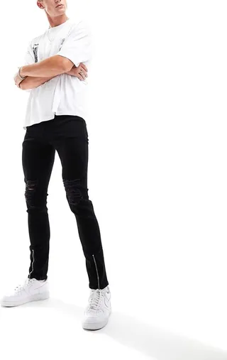ASOS DESIGN skinny jeans with rips in black