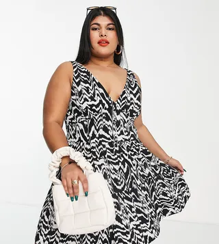 ASOS DESIGN Curve tiered sundress with button waist detail in black and cream abstract print